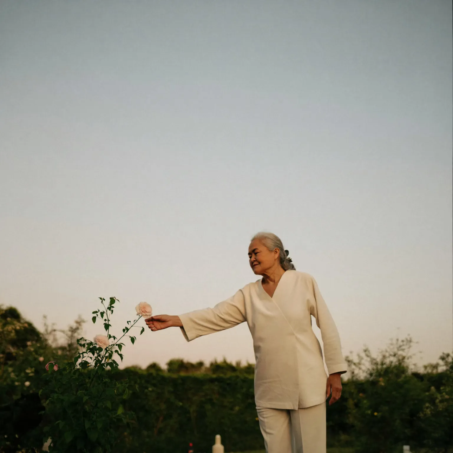 An older woman in a garden