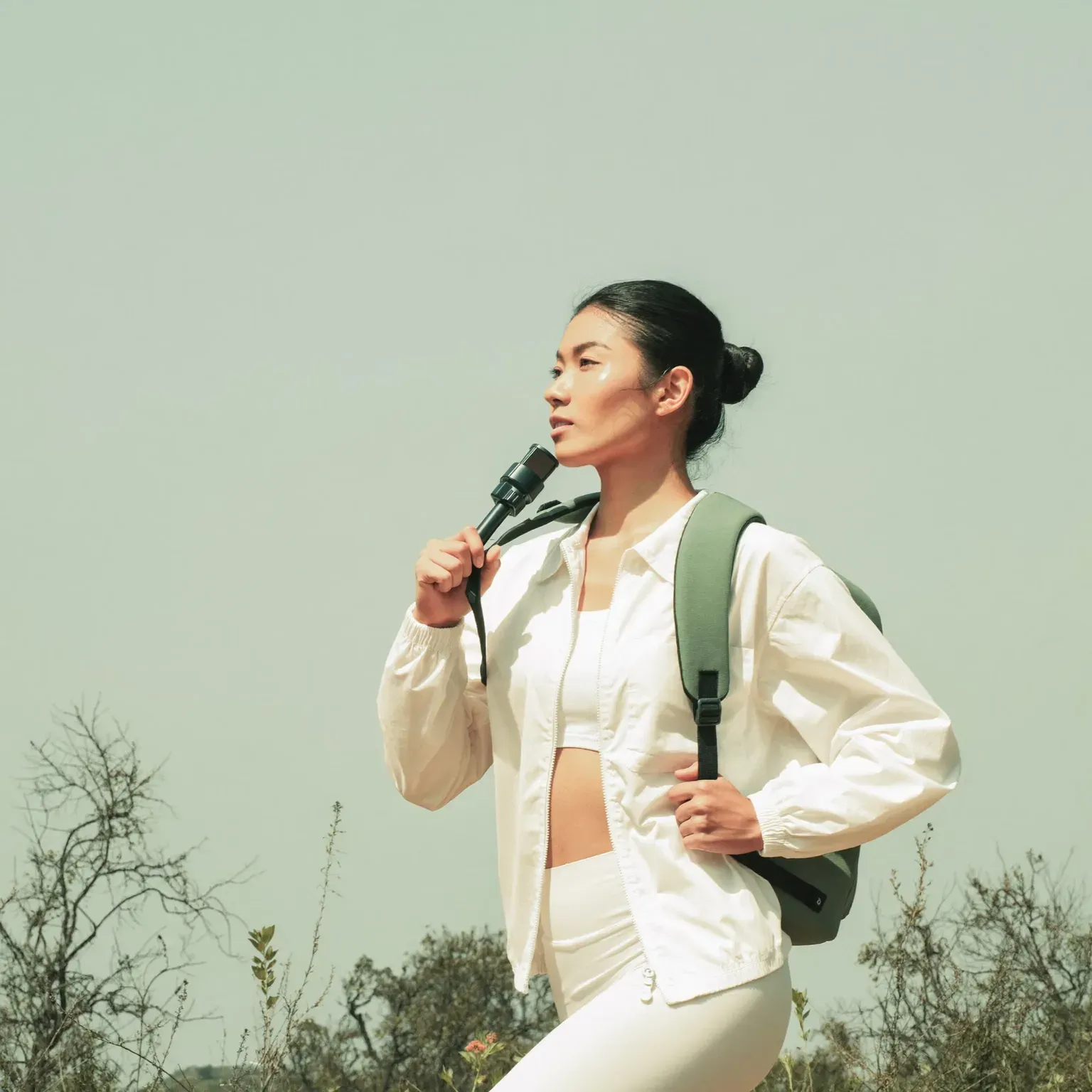 A woman hiking with a backpack